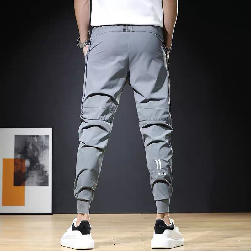 Pantalones deportivos casuales pantalones de secado rápido de cintura elástica fresca de estilo fino de verano para hombres