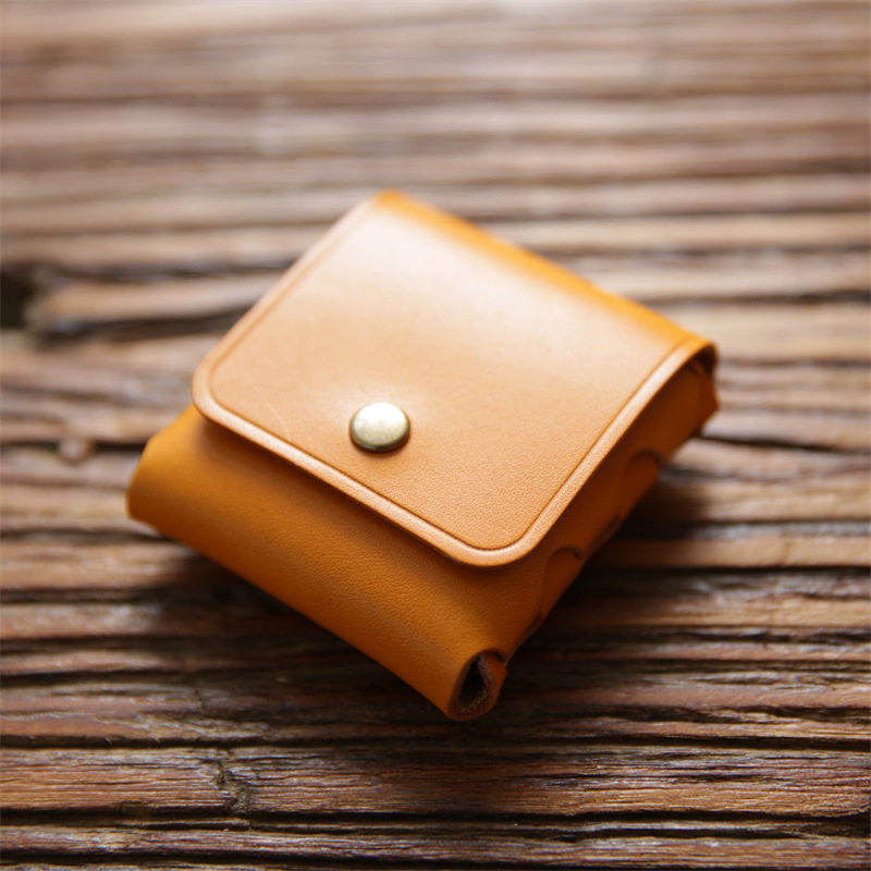男女のミニ小銭入れは、トップの牛革をなめして、硬貨を掛けて、本革のイヤホンの保護カバーをしています。