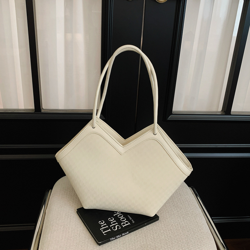 Nicho transfronterizo bolsas de diseño casual para mujeres 2026 nueva moda diaria de verano de gran capacidad de viaje a la axila bolsa de mano