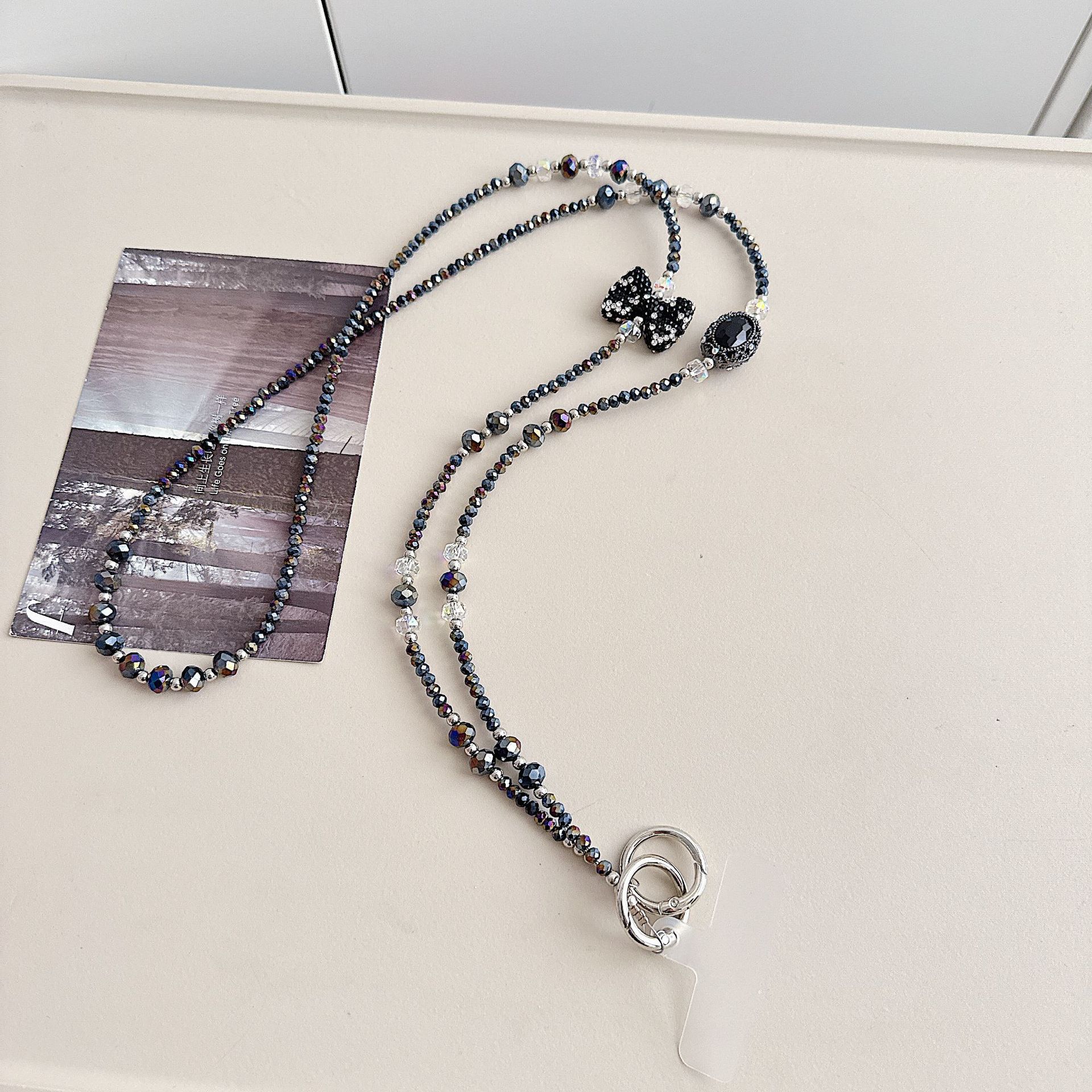 Boutique hecho a mano de alta gama teléfono móvil cadena colgante ins mujer ligero lujo dulce fresco estilo princesa moda teléfono móvil cadena colgante mensajero largo