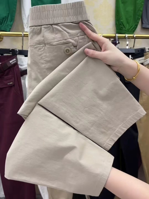 ヨーロッパの商品の夏の薄いタイプの9分のズボンの女性の新型の高弾性の綿のゆったりしている腰のハーレムのズボンの百合はやせているおばあさんのズボンを現します。|undefined