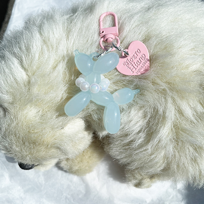 Pequeño Libro Rojo mismo lindo jalea globo láser perro llavero colgante colorido cachorro de dibujos animados teléfono llavero