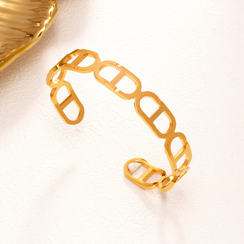Fábrica en stock al por mayor de Europa y América transfronteriza de acero inoxidable en forma de C pulsera abierta ajustable chapado en oro 18K personalidad no se desvanece