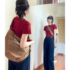 香港の味のレトロな夏のデザイン感のある肩の半袖のアルファベットのプリントtシャツの女性の大衆の独特な短いタイツの上着