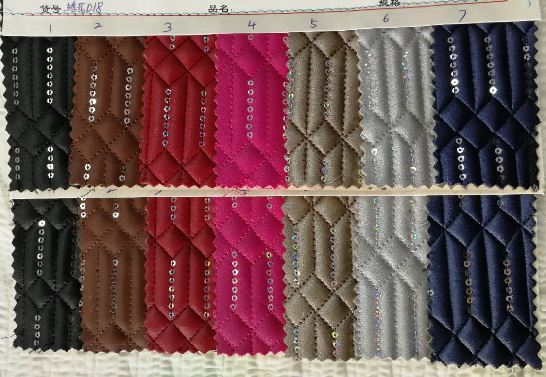 刺绣箱包人造革细羊纹绣箭头亮片拉毛底3mm海棉加高温弹力布