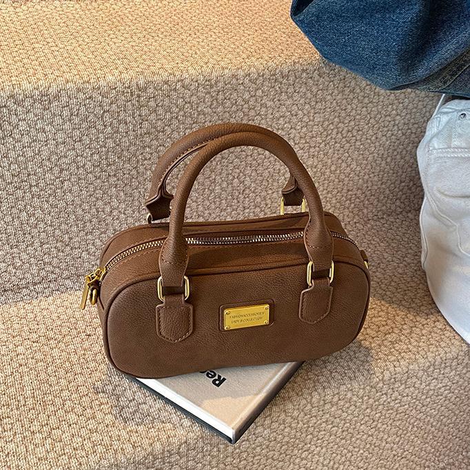 Bolso de bolos de mano de moda 2024 nuevo bolso de mujer retro simple bolso de hombro de alta calidad bolso de mochila universal mujer