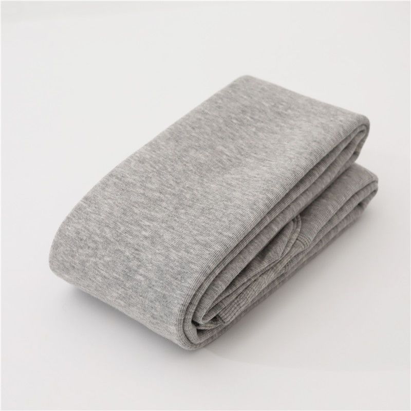 カシミヤの底のズボンの女性のベルベットの厚いズボンの靴下の春秋冬の系のオート麦の白い薄い色の縦の紋様の保温のズボンはやせています。