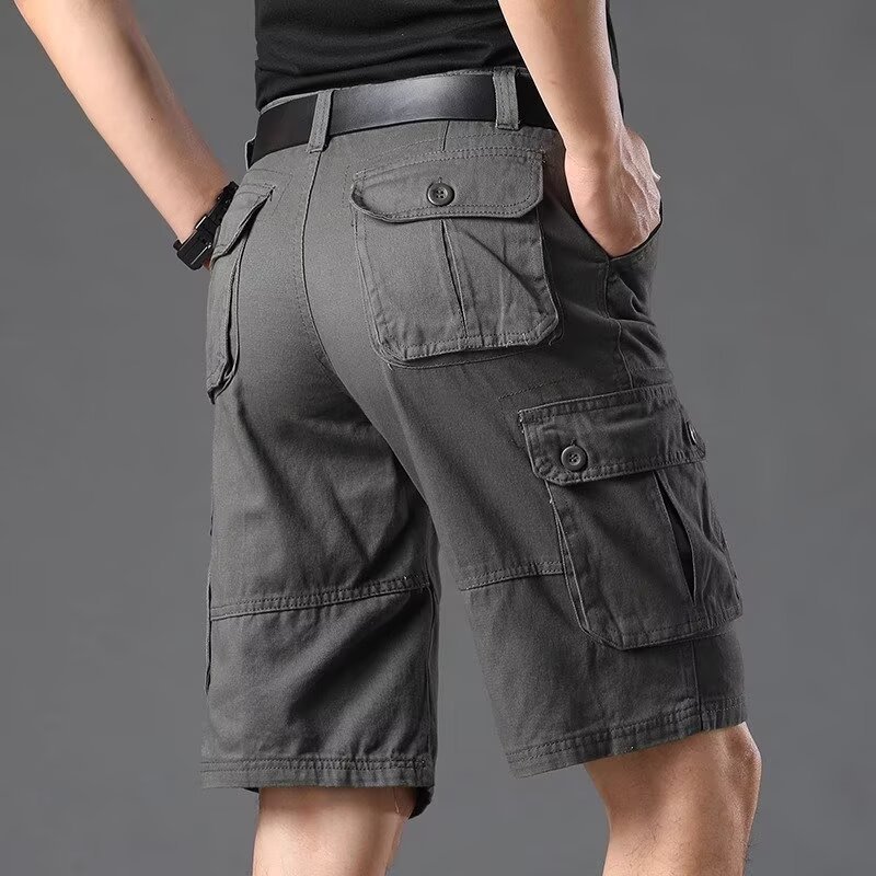 Inventario de verano pantalones cortos sueltos de bolsillo pantalones de herramienta de moda pantalones elásticos de cinco puntos pantalones casuales delgados para hombres