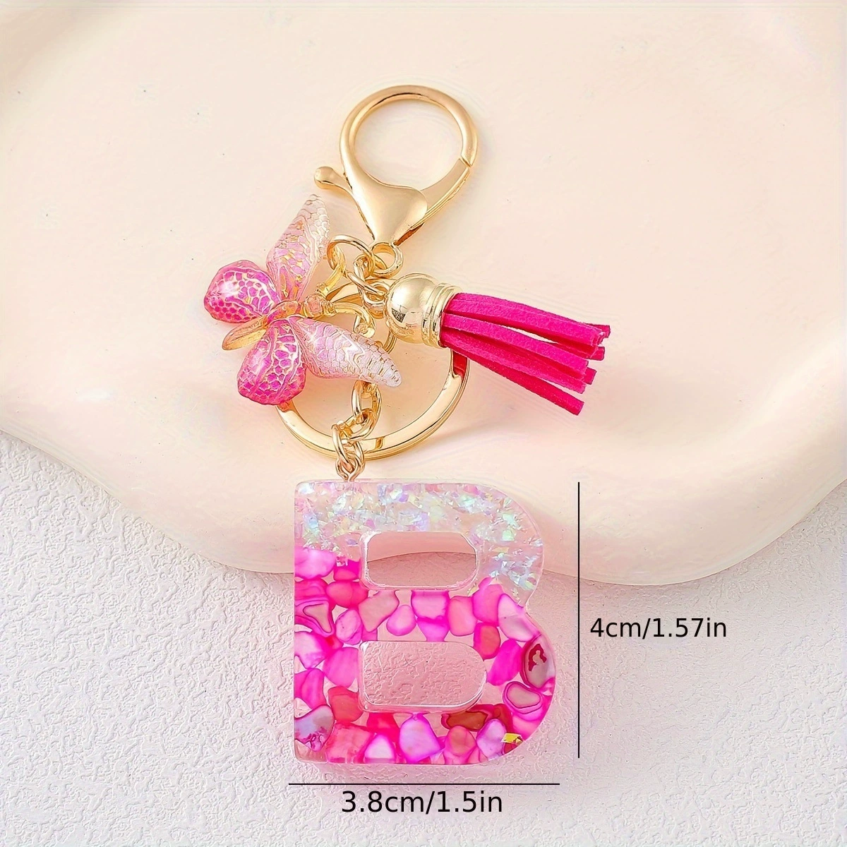 Pink golden keychain with tassels, gradient, with gem