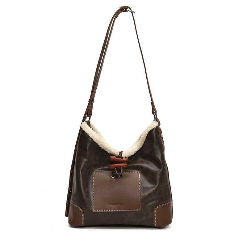 Bolsa de lana de cordero coreana debajo de la axila para mujeres 2025 nuevo estilo de bolsa de transporte de textura universal moda bolsa de transporte de mujer