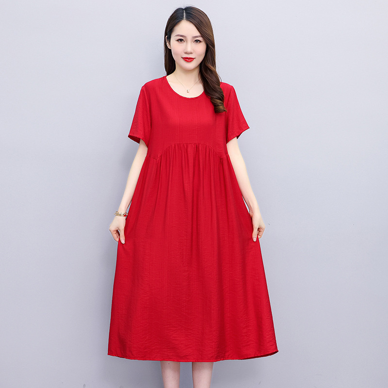 夏の新型純色半袖綿のワンピースの女性ファッションのお母さんの服はやせてゆったりしている気質の中の長いスカートを現します。|undefined