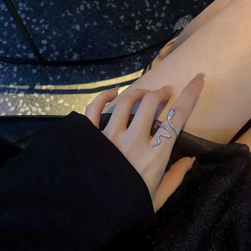 Brand small design ring, on index finger