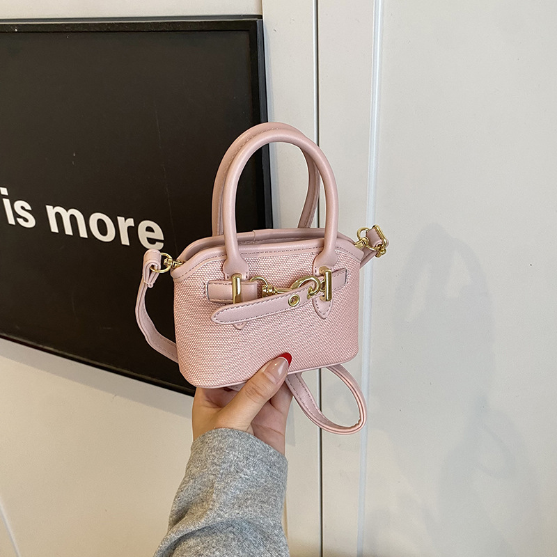 Bolsos de mano para niños lindos colgantes extranjeros mini bolsos de hombro para niños y niñas de color sólido simple bolsos de conchas de niños de moda