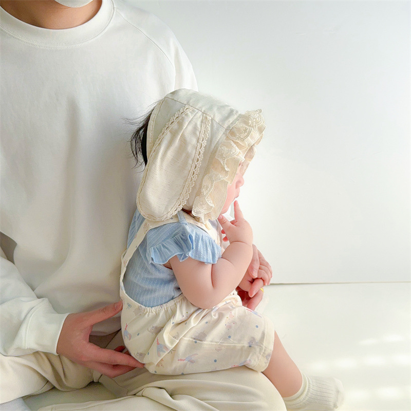 Sombrero de bebé primavera y verano nuevo estilo protector solar para bebés, encaje para bebés y niños pequeños, gorras de palacio de luna pequeña, gorras de protección para los oídos de fontanela