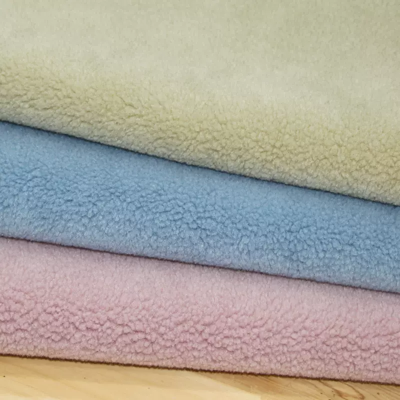 全毛小颗粒羊绒面料 麂皮绒复合羊剪绒 时装羊羔绒布料
