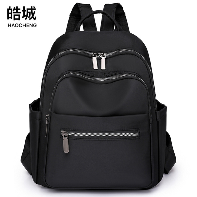 Transfronterizo al por mayor 2023 nueva mochila de nailon para mujer coreana simple y versátil mochila de viaje anti-salpicaduras de agua mochila escolar