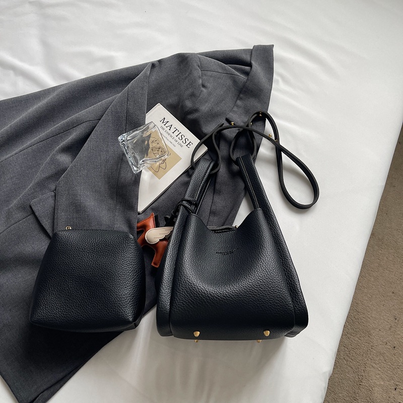 Este año popular simple bolso de cubo portátil para mujeres 2026 nuevo estilo de alto nivel lichi estampado lujoso mochila de hombro