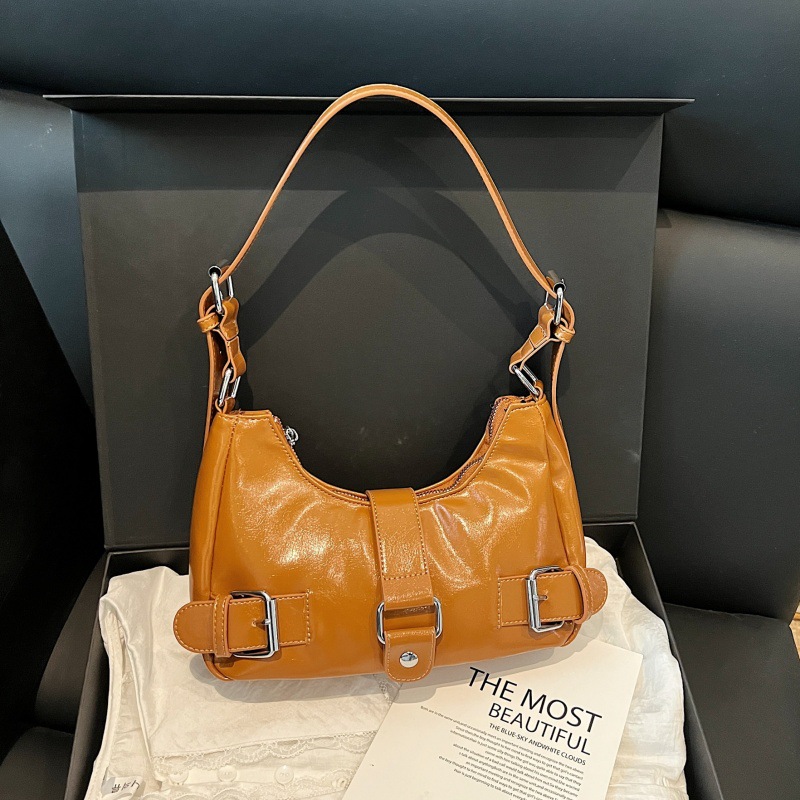 Bolso retro estilo de Hong Kong 2025 verano nuevo bolso femenino de alta calidad textura bolso de hombro moda estilo motocicleta bolso de mensajero