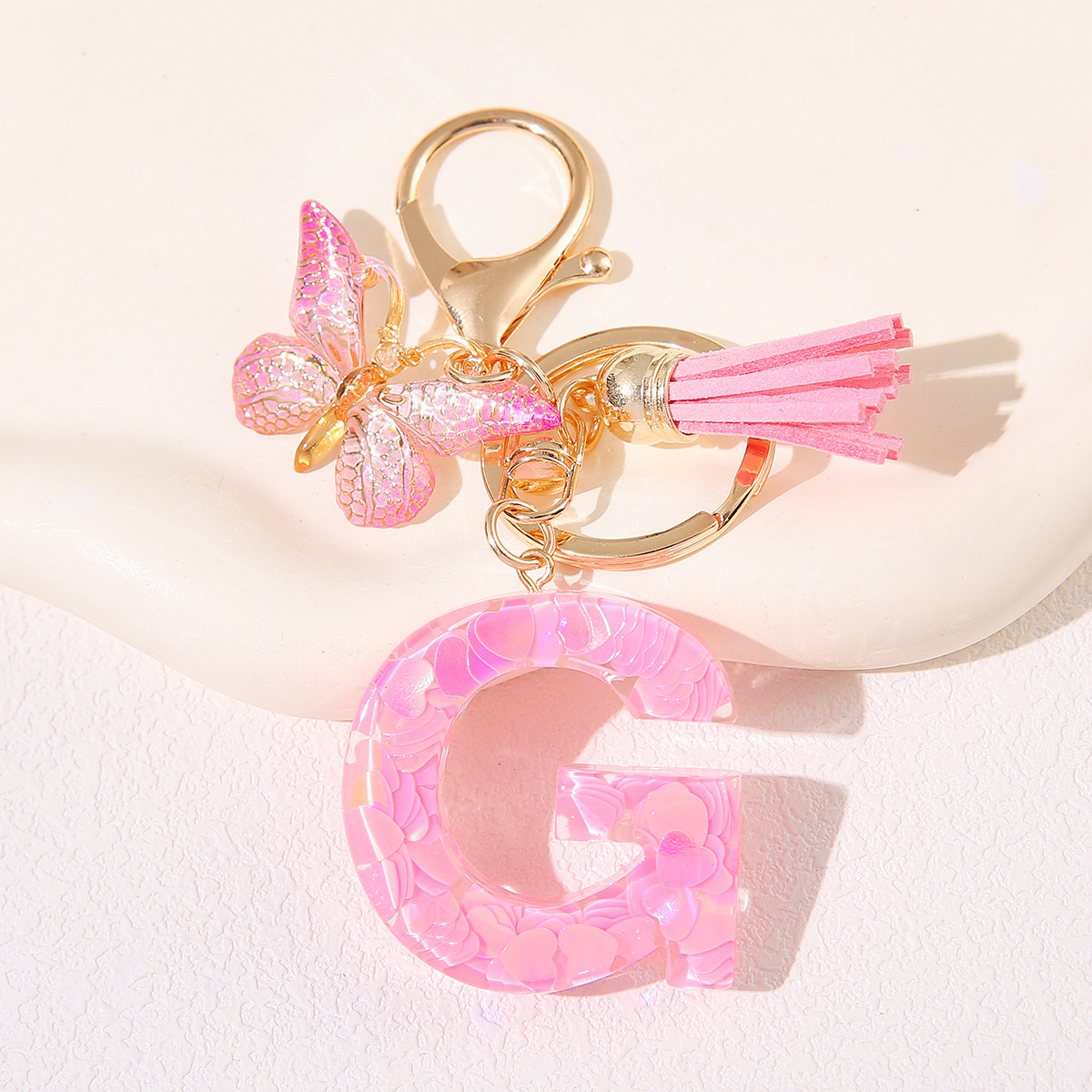 Nuevo rosa damas letras A-Z llavero de goteo de goma sequilla amor letras bordas mariposa llavero transfronterizo