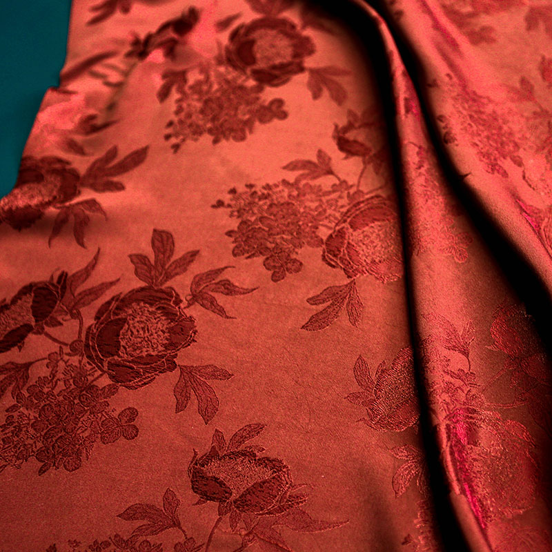 朱红色山茶花人丝提花面料垂顺柔软夏日轻薄衬衫套装旗袍裙子布料