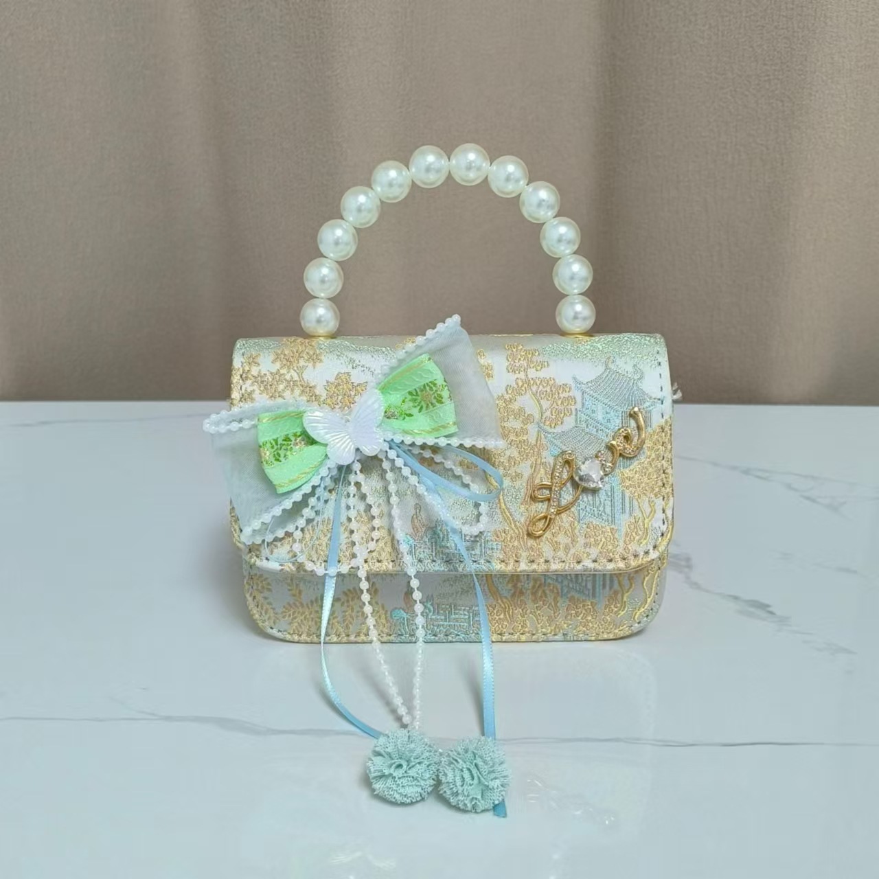 Bolsos infantiles de alto nivel antiguo bolso de cambio de niña pequeña princesa de perlas accesorios de ropa Han bolso de almacenamiento