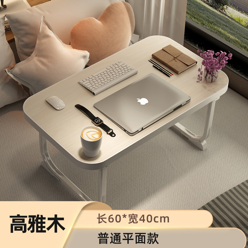 ベッドの上の机は折りたたみます。|undefined