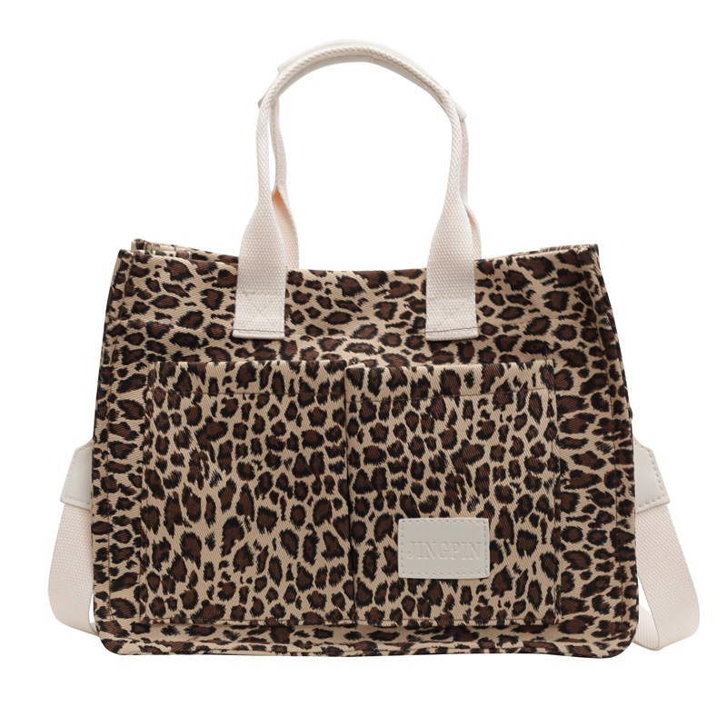 Leopardo tela bolsa de tela para mujeres bolsa de gran capacidad 2024 nuevo estilo relajado sensación de mano viaje bolsa de hombro de mamá