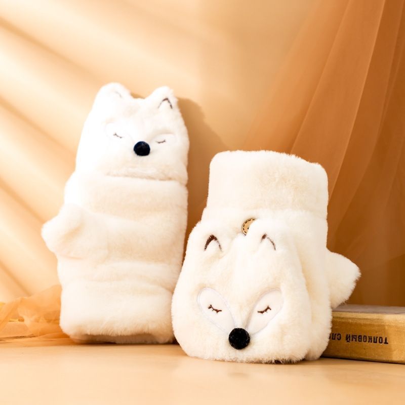 かわいいキツネが半分の指の手袋をしています。|undefined