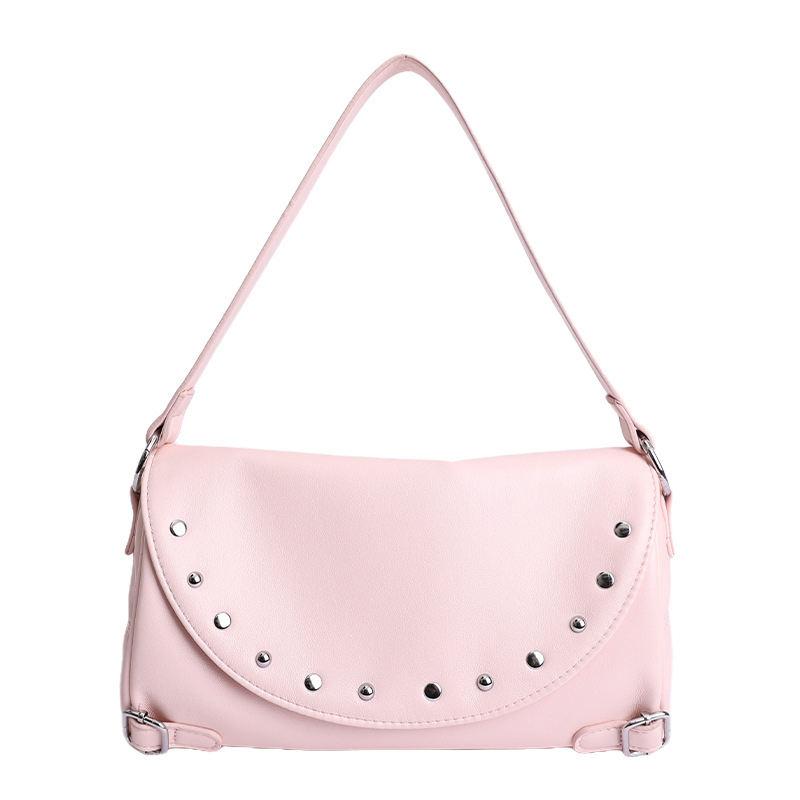 Texturas de moda primavera y verano retro bolsas de brazo 2026 nuevo estilo de este año popular remaches de hombro bolsas de tramo inclinadas