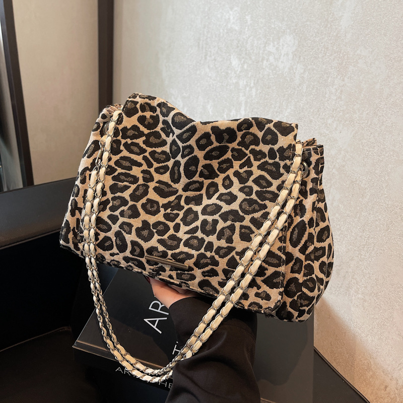 Bolsa de gran capacidad de tela de leopardo rojo, bolso de mujer 2024, nueva moda, textura de hombro, braza, mochila de estilo extranjero, mujer