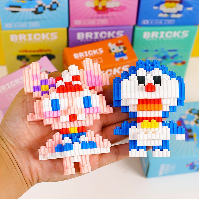 Pequeños bloques de construcción de partículas para niños compatibles con bloques de construcción Lego venta caliente muñeca de dibujos animados rompecabezas para niños caja ciega al por mayor