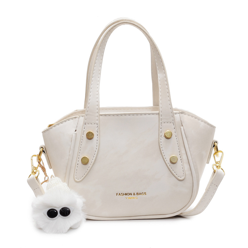 Nicho de diseño de tendencia bolso de cubo de mano mujer 2025 nueva moda bolso de hombro de estilo extranjero para trabajar bolso de transporte