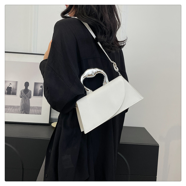 Nicho francés popular bolso de color sólido bolso de mujer 2024 verano nuevo estilo simple ocio red mochila de hombro