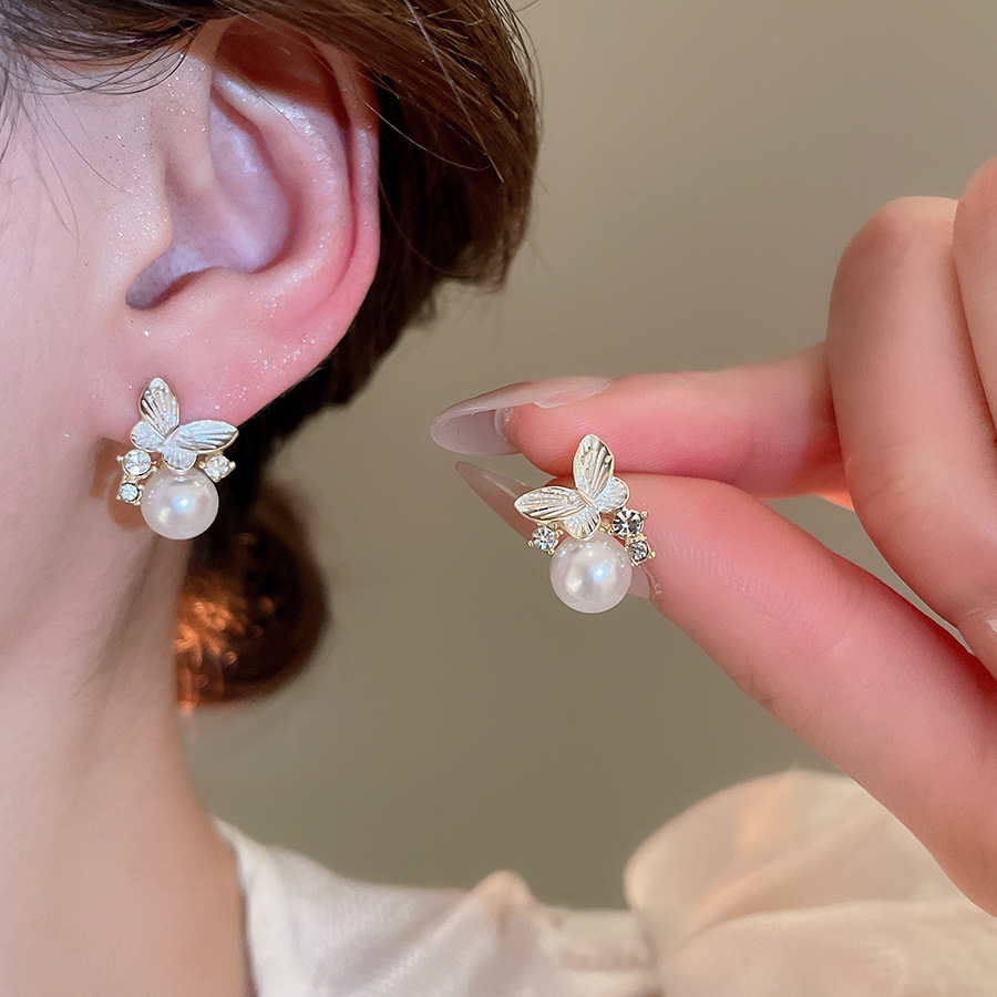 Aguja de plata, perla, circón, borla, pendientes de moda, lujo ligero, pendientes de alta gama, pendientes de todo fósforo exquisitos de nicho, mujeres al por mayor