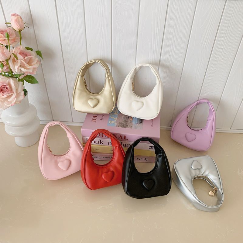 Bolso de amor de la princesa de aire exterior compacto mini bolso de cambio de moda de color sólido 2026 bolso de comercio exterior transfronterizo para niños