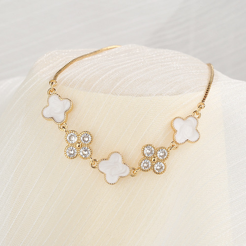 Live broadcast lucky four-leaf clover champagne gold bracelet for women, light luxury fashion imitation mother-of-pearl glue pull-down adjustment bracelet