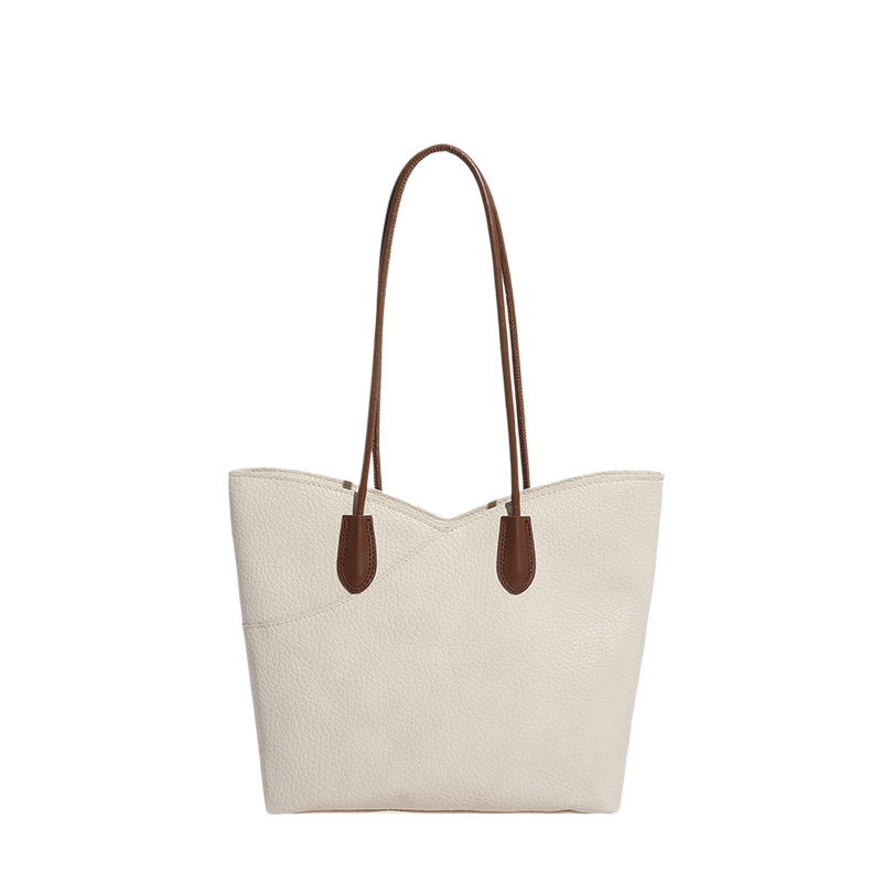 Bolsa de mano de textura superior para mujeres 2026 nicho transfronterizo bolso de hombro ligero de lujo de gran capacidad de viaje a la braza