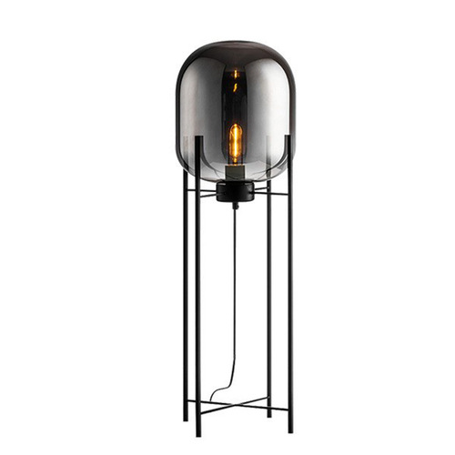 Postmodern Nordic industrial style smoke gray glass four-legged floor lamp with creative and personalized design for living room and bedroom.