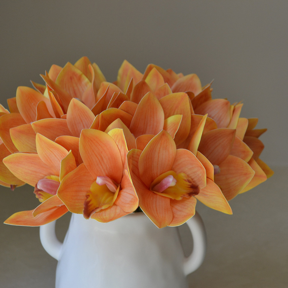 cymbidiums with bunches and flowers in hand, home model room decoration, dining table and coffee table decorations, fake flowers_voghion.com