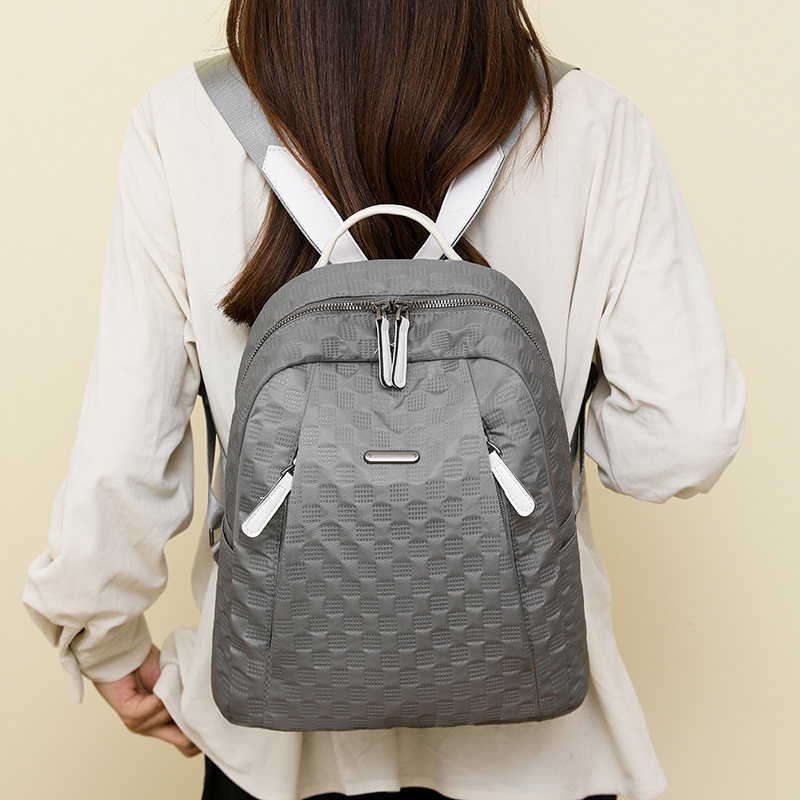 2024 otoño nuevo estilo casual todo fósforo damas mochila de nailon moda color de contraste ligero mochila de viaje de viaje