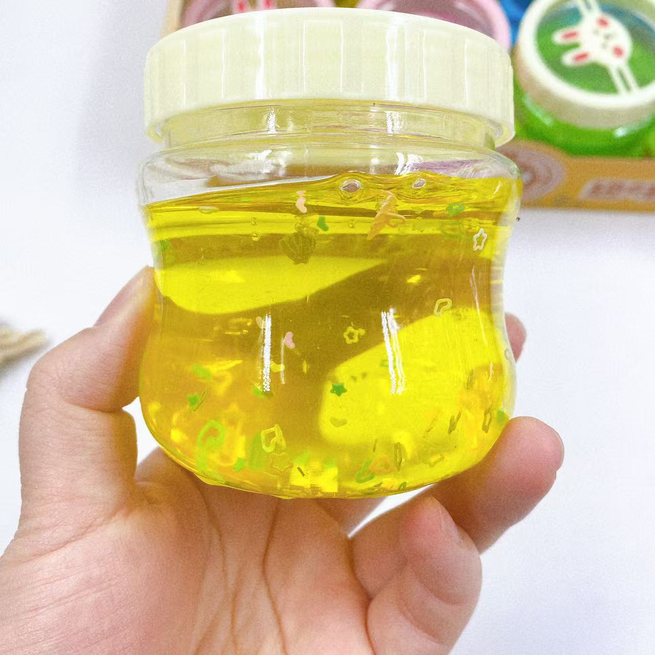 Nuevo color barro dibujos animados pegamento espumoso color brillante rompecabezas de alta transparencia descompresión hecha a mano juguetes para niños al por mayor