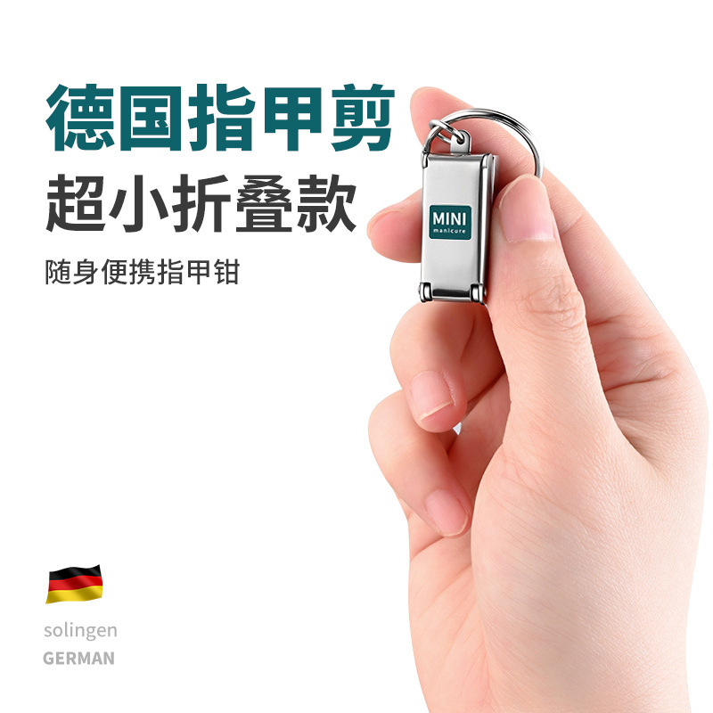 Acero inoxidable plegable mini pinza de uñas portátil único conjunto de cortador de uñas tijeras de uñas con llave colgante