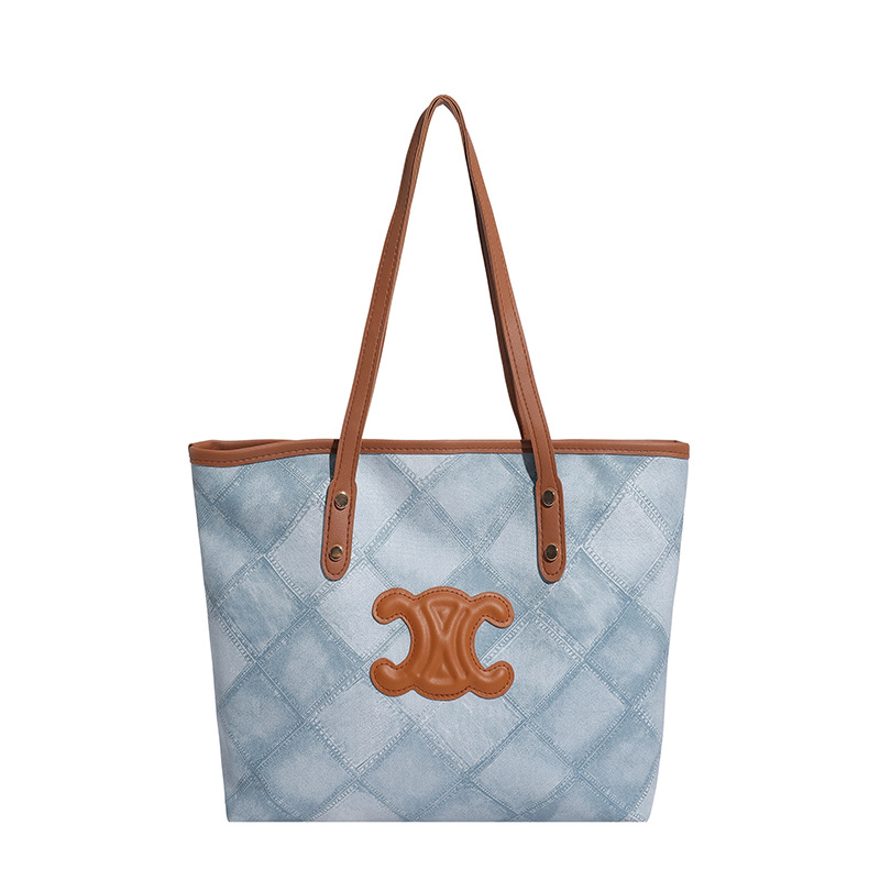 Bolsa de mano transfronteriza de gran capacidad para mujeres 2025, nueva sensación de alta calidad, bolso de hombro de viaje universal, bolso de moda