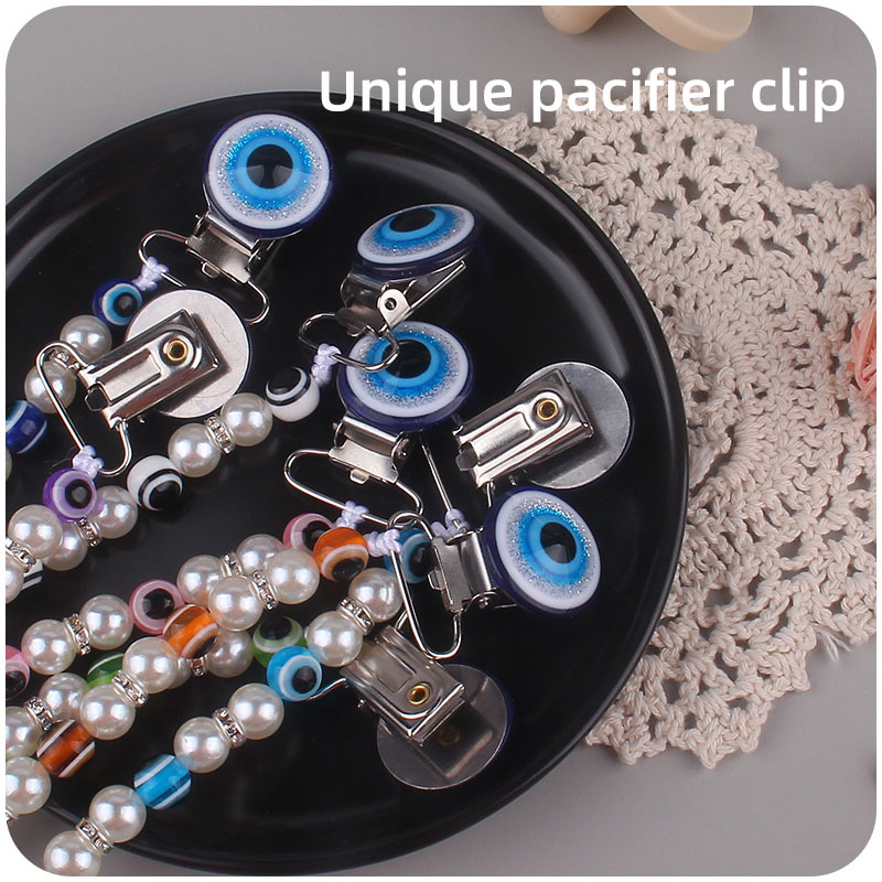 Suministros para bebés chupete de acrílico cadena anti-gota ojos azules bebé chupete clip chupete cadena Amazon nuevo