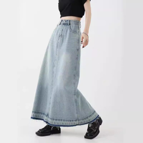 Vintage American design flared denim skirt for women, mini length, featuring frayed edges, high-waisted for a slimming effect, A-line style, suitable for spring.