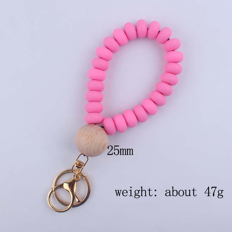 Korean Style Solid Color Wood Silica Gel Metal Beaded Unisex Keychain display picture 4