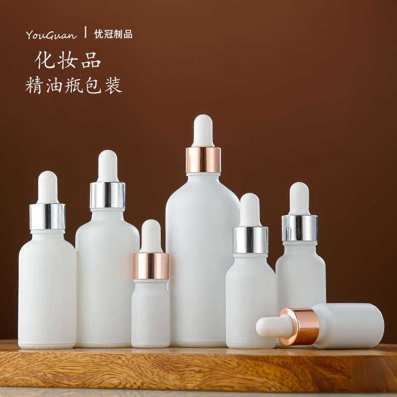 Venta al por mayor aerosol blanco botella de aceite esencial botella cosmética sub-botella 30ml esencia líquida botella redonda botella de plástico cabeza cuentagotas