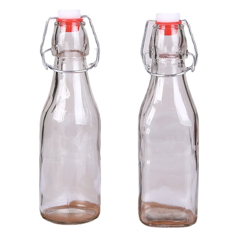 Bloquear botella de vidrio transparente redonda hebilla cuadrada botella de vidrio jugo botella de vino enzima botella de vino de cerveza casera botella de vino blanco botella vacía