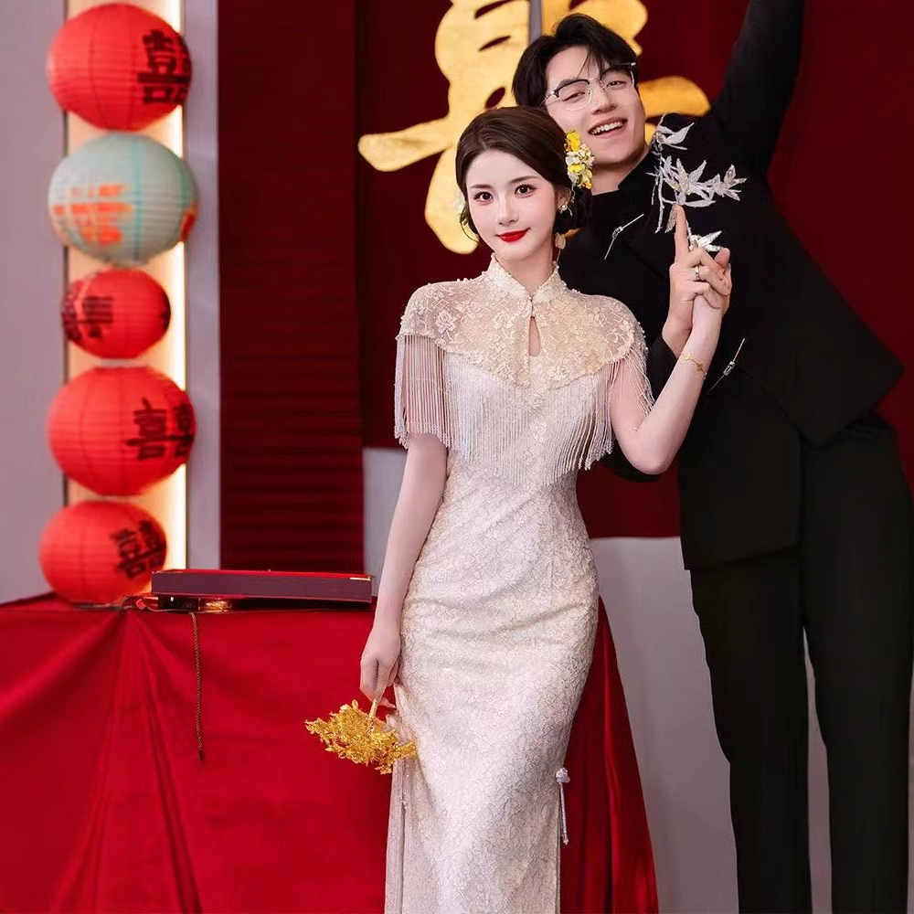 New Chinese-Style Improved Cheongsam Bridal Toast Dress 2026 New Model Stand Collar Shoulder Tassel Champagne Color Slim Fit Dress