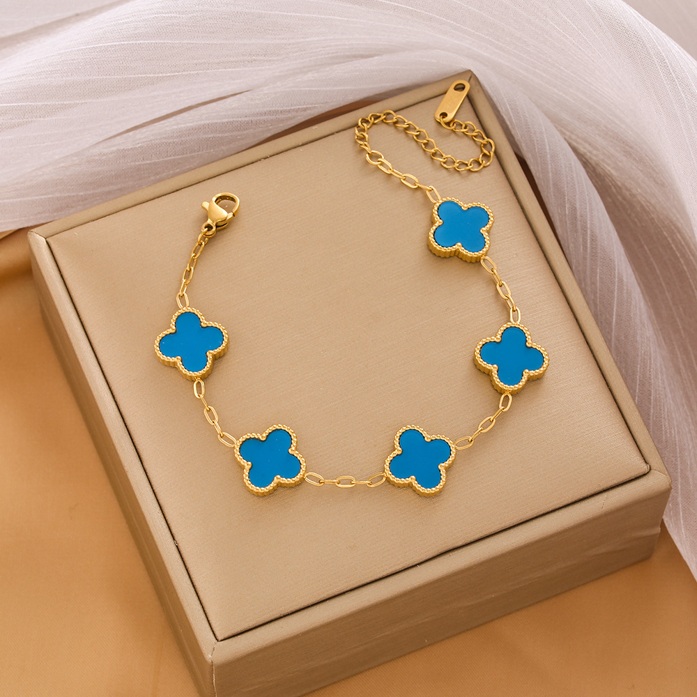 Pulsera de trébol de acero titanium vendedora caliente transfronteriza europea y americana con incrustaciones de concha pulsera colgante pulsera de diseño avanzado sin desvanecimiento al por mayor